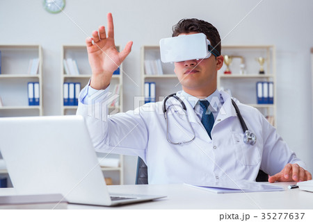 Young doctor with vr virtual reality headset 35277637