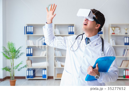Young doctor with vr virtual reality headset Young doctor with vr virtual reality headset 35277652