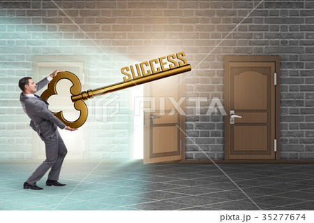 Businessman with key to success business concept 35277674