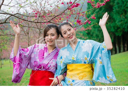 smiling women friends wearing traditional kimono smiling women friends wearing traditional kimono 35282410