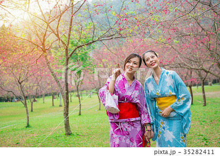 happy elegant girls wearing japanese kimono happy elegant girls wearing japanese kimono 35282411