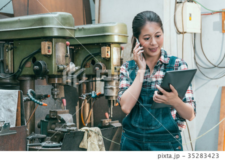 smiling female milling machine factory manager smiling female milling machine factory manager 35283423