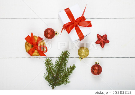 Christmas cookie, spruce branch, gift and balls. 35283812