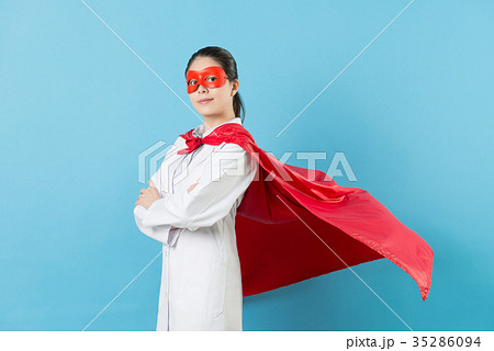 confident female doctor wearing superhero costume 35286094