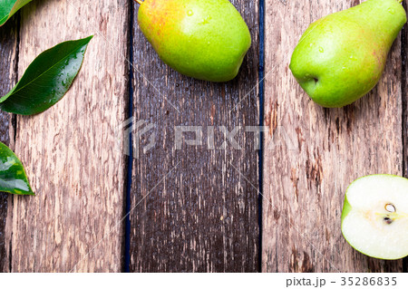 Pear on wooden rustic background. Top view. 35286835