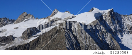 Rugged mountains and glacier in Valais Canton. 35289593