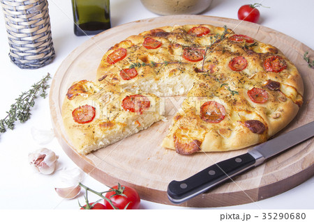 Fresh bread focaccio with tomatoes and cheese Fresh bread focaccio with tomatoes and cheese 35290680
