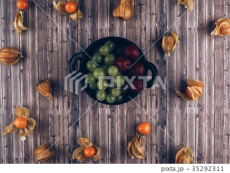 Organic physalis, green grapes and gooseberries. Organic physalis, green grapes and gooseberries. 35292311