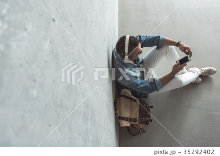 Cute pleasant guy is listening to music Cute pleasant guy is listening to music 35292402