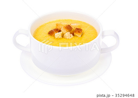 Tasty pumpkin puree soup in white soup tureen 35294648