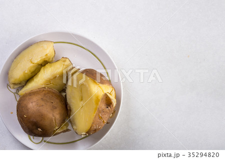 Flat lay above served cooked potatoes above marble 35294820