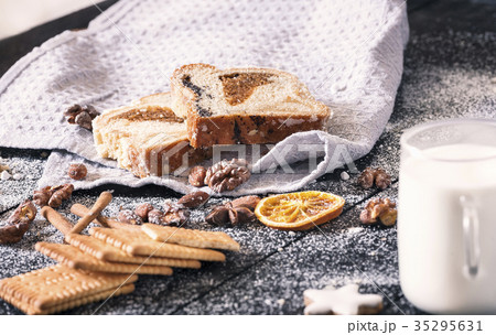 Slices of sponge cake and roasted nuts Slices of sponge cake and roasted nuts 35295631
