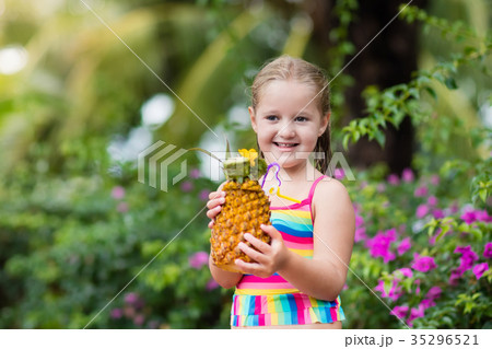 Child drinking juice in swimming pool bar Child drinking juice in swimming pool bar 35296521