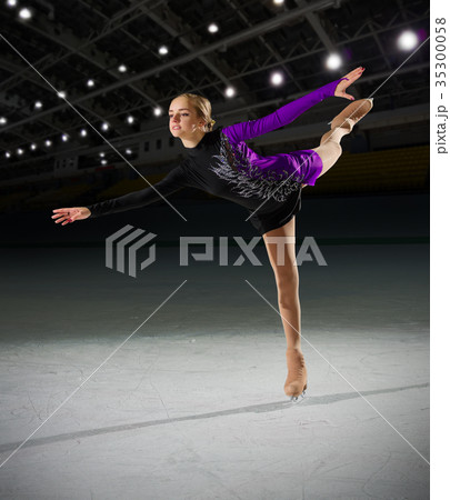 Woman figure skater at sports hall Woman figure skater at sports hall 35300058