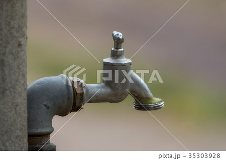 Simple water faucet with soft background 35303928