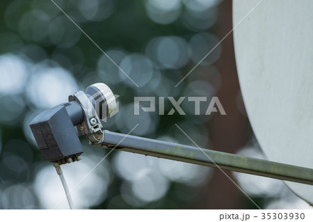 View of a satellite dish with a cable 35303930