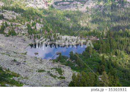 Fantastic sunny day is in mountain lake. Creative 35303931