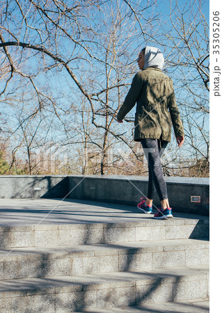 Young woman in sports clothing and the hood Young woman in sports clothing and the hood 35305206