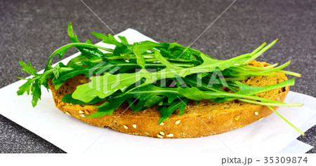 Dietary sandwich with bread and arugula 35309874