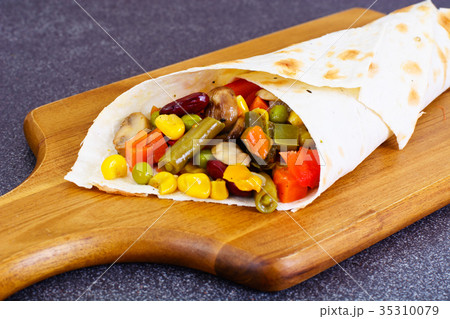 Shawarma Lavash with Chicken and Vegetables Shawarma Lavash with Chicken and Vegetables 35310079
