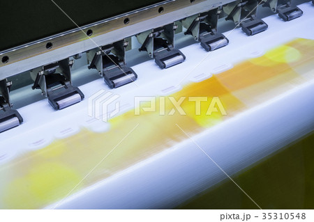 Close up inkjet printer working on vinyl banner Close up inkjet printer working on vinyl banner 35310548