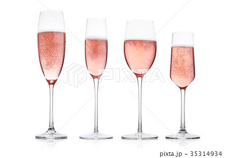 Champagne rose glasses with bubbles on white 35314934