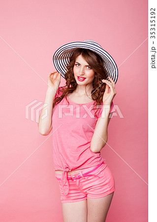 the girl in the hat on a pink background pinup the girl in the hat on a pink background pinup 35315192