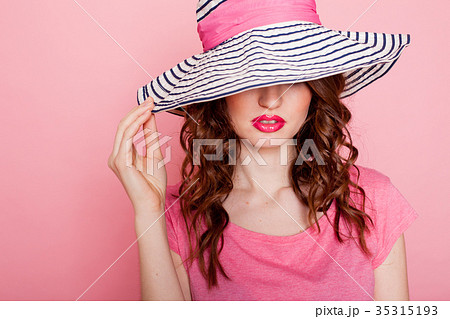 the girl in the hat on a pink background pinup 35315193