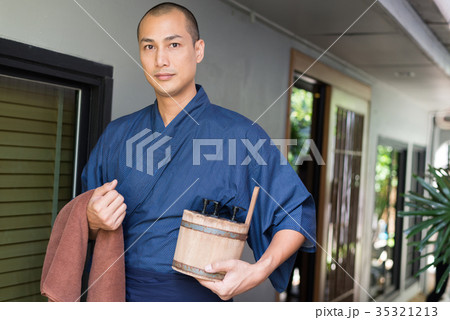 Onsen series: Asian man holding wooden bucket 35321213
