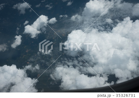 Aerial view above the clouds from airplane window 35326731