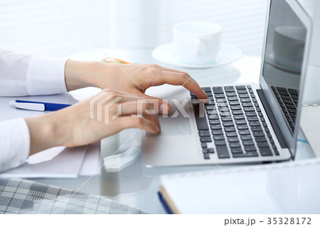 Close up of business woman hands typing on laptop 35328172