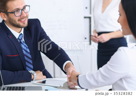 Business handshake at meeting or negotiation in Business handshake at meeting or negotiation in 35328382