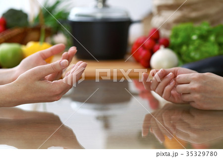 Close-up of human hands are gesticulate over a 35329780