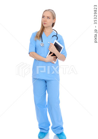 Smiling young nurse portrait isolated over white Smiling young nurse portrait isolated over white 35329823