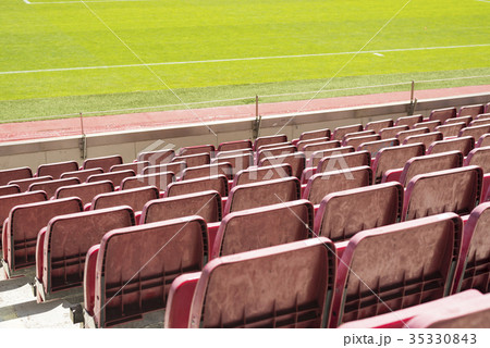 Red stadium seat in soccer stadium Red stadium seat in soccer stadium 35330843