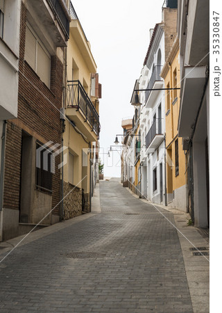 A narrow street of old houses A narrow street of old houses 35330847