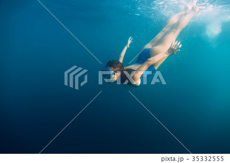 Young woman swimming in ocean, snorkeling 35332555