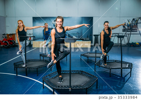 Women group doing fit exercise on sport trampoline 35333984