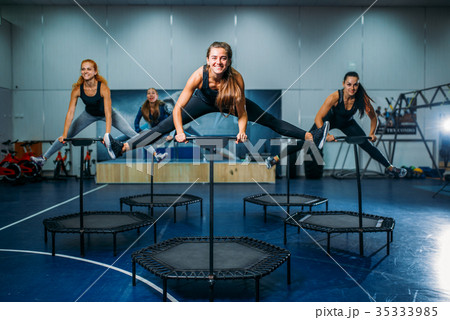 Women group on sport trampoline, fitness workout 35333985