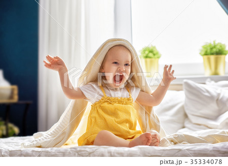 baby girl on the bed 35334078