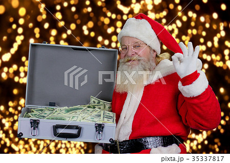 Santa Claus with full case of dollars. 35337817
