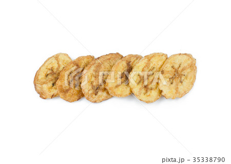 Dried banana slices isolated on white background Dried banana slices isolated on white background 35338790