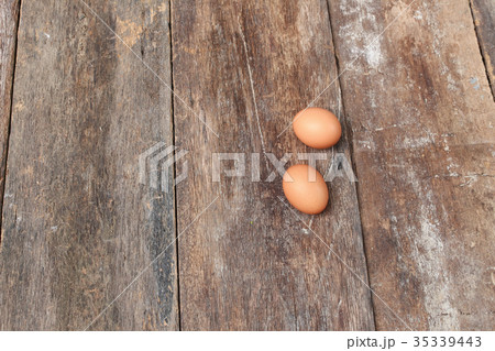 egg on wood background. Top view 35339443