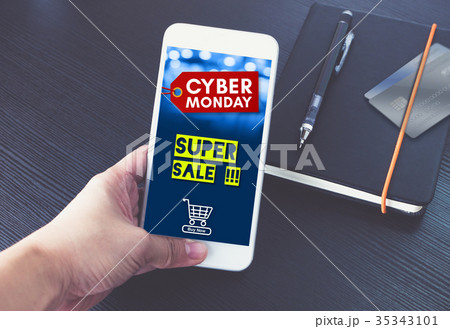 Cyber monday sale tag with shopping cart on mobile Cyber monday sale tag with shopping cart on mobile 35343101