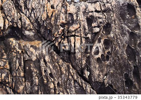 Patterns and textures of the old volcanic rock Patterns and textures of the old volcanic rock 35343779