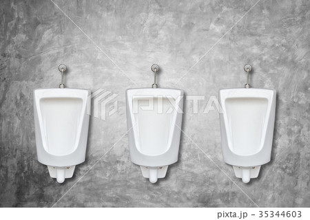 Row of ceramic outdoor urinals in men public toilet install on the wall Row of ceramic outdoor urinals in men public toilet install on the wall 35344603