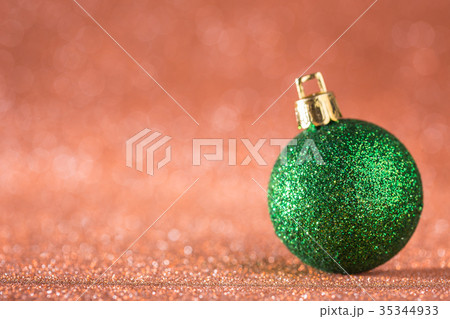 Christmas and New Year Background. Shiny Christmas Ball on Red Holiday and New Year Abstract Blurred Defocused Background Christmas and New Year Background. Shiny Christmas Ball on Red Holiday and New Year Abstract Blurred Defocused Background 35344933