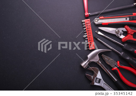 New square black tool box on black granite board background. Composition with free space for text or design 35345142