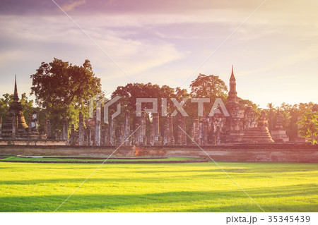 Sukhothai Historical Park at Sunset time, Sukhothai province, Located in a beautiful setting of lawns, lakes and trees in north-central, Thailand 35345439