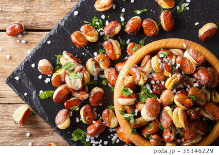 fried broad beans with salt and herbs in a bowl fried broad beans with salt and herbs in a bowl 35346229